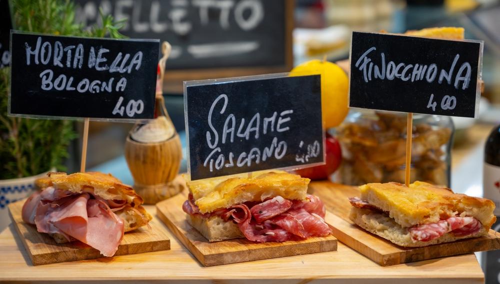 Italian street food. Ham, sandwiches. Bread with cured meats.